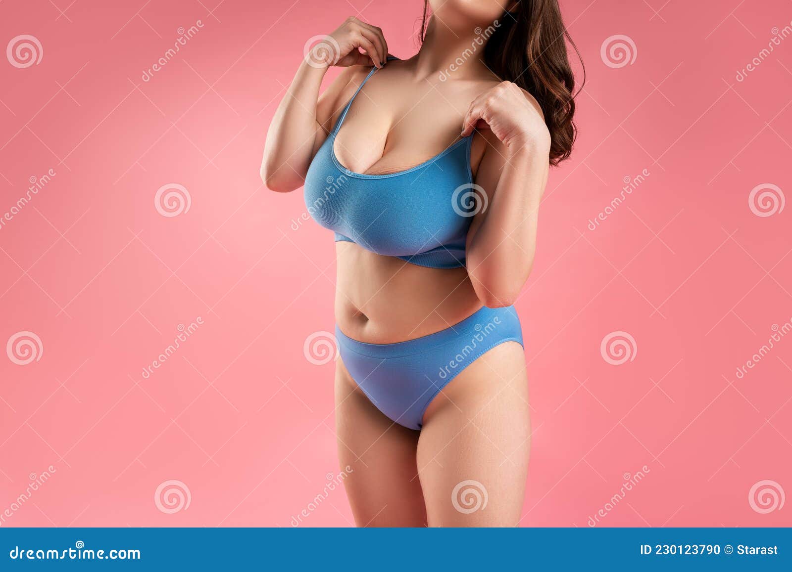 Fat Woman with Very Large Breasts in Blue Underwear on Pink