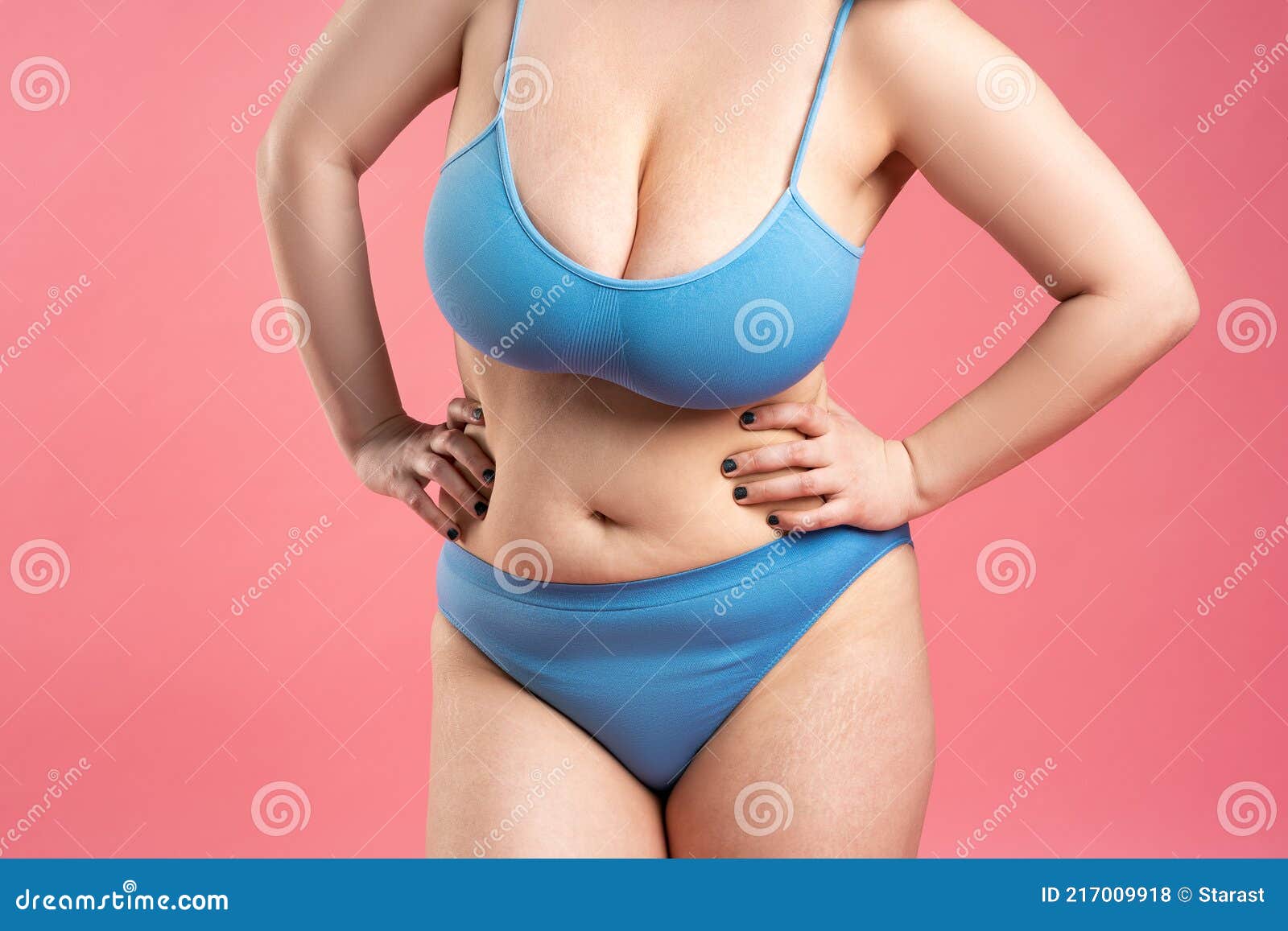 Fat Woman with Very Large Breasts in Blue Underwear on Pink