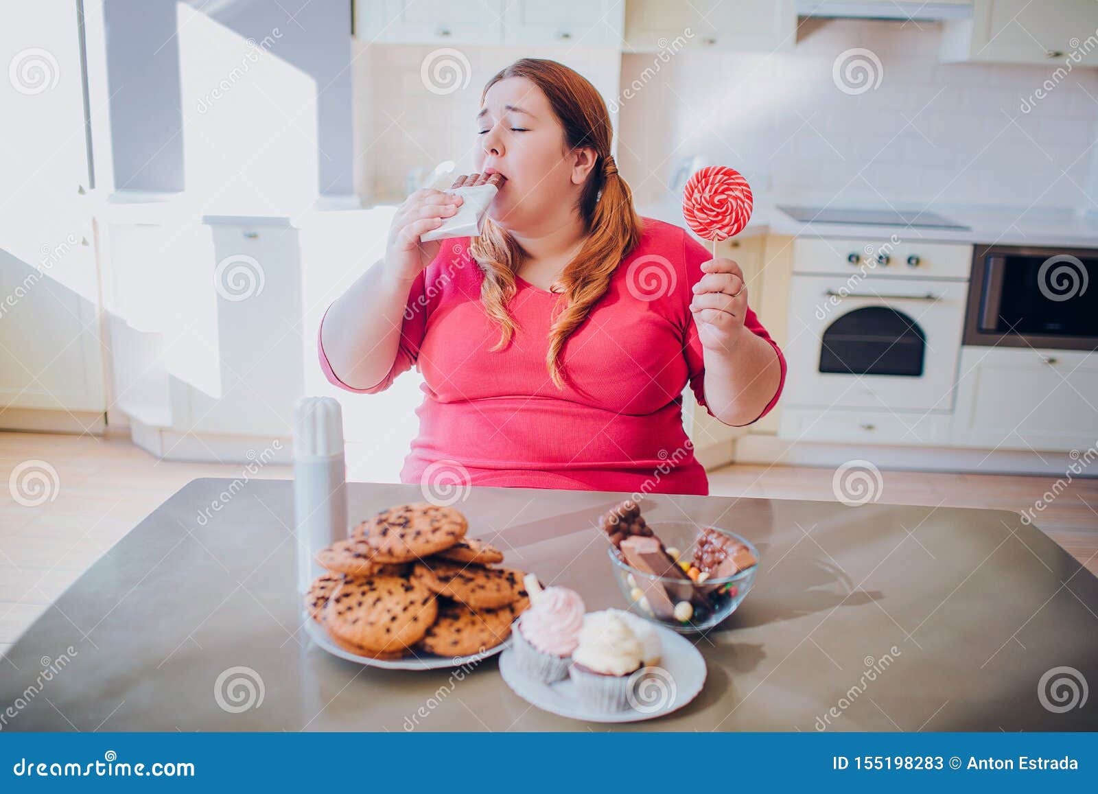Vidunderlig hver for sig erstatte Fat Young Woman in Kitchen Sitting and Eating Sweet Food. Biting Chocolate.  Cookies and Cakes on Table. Body Positive Stock Image - Image of cookies,  dieting: 155198283