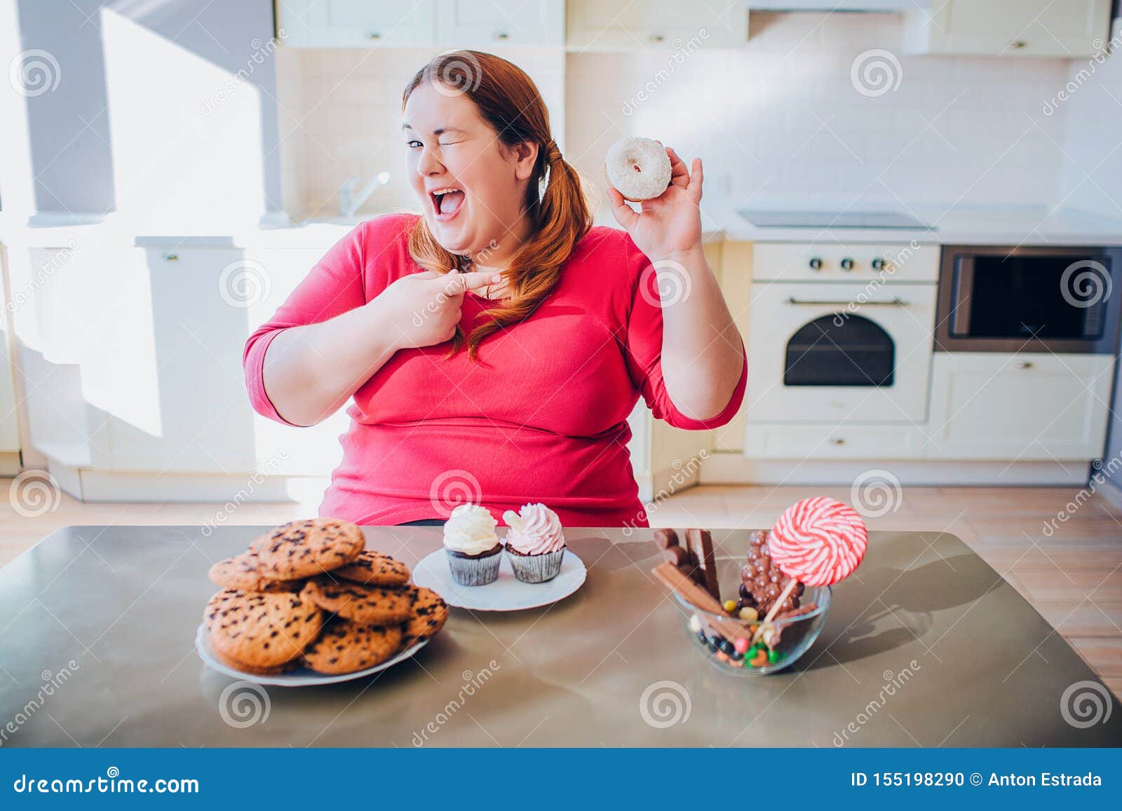 Fat Young Woman In Kitchen Sitting And Eating Sweet Food Happy Plus