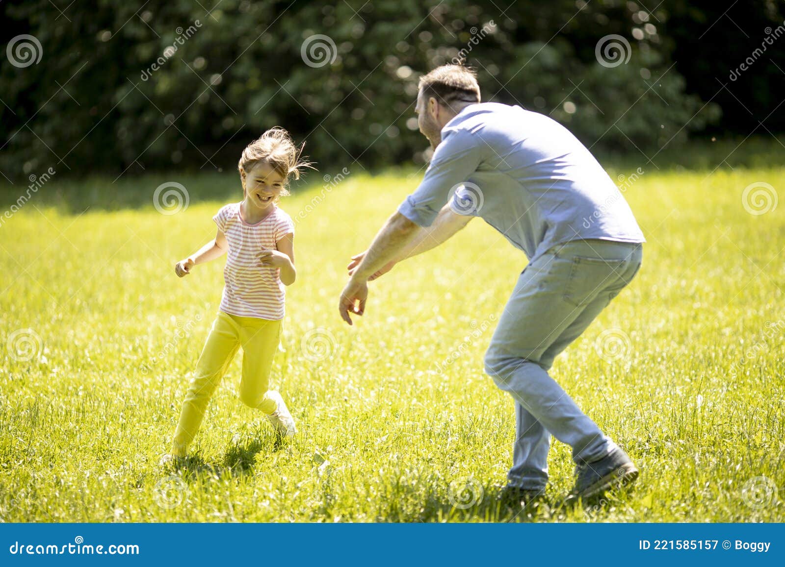 Father Chasing His Little Daughter While Playing In The Park Stock Image Image Of Male