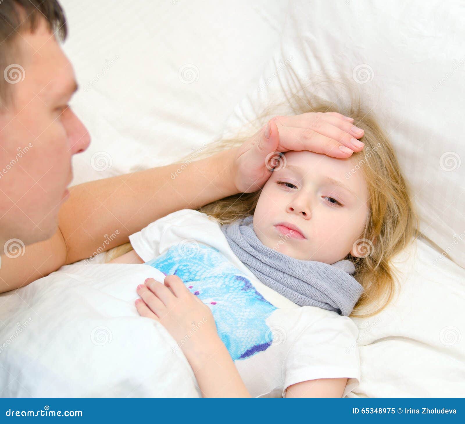 Father Checks Temperature Of Sick Daugher With His Hand Stock Image 