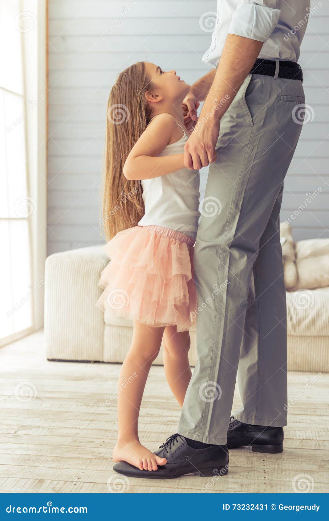 Positive parents and their two cute daughters smiling and having fun at  green summer park. Father holding little daughter, girl is flying. Concept  of family, leisure and happiness Stock Photo - Alamy