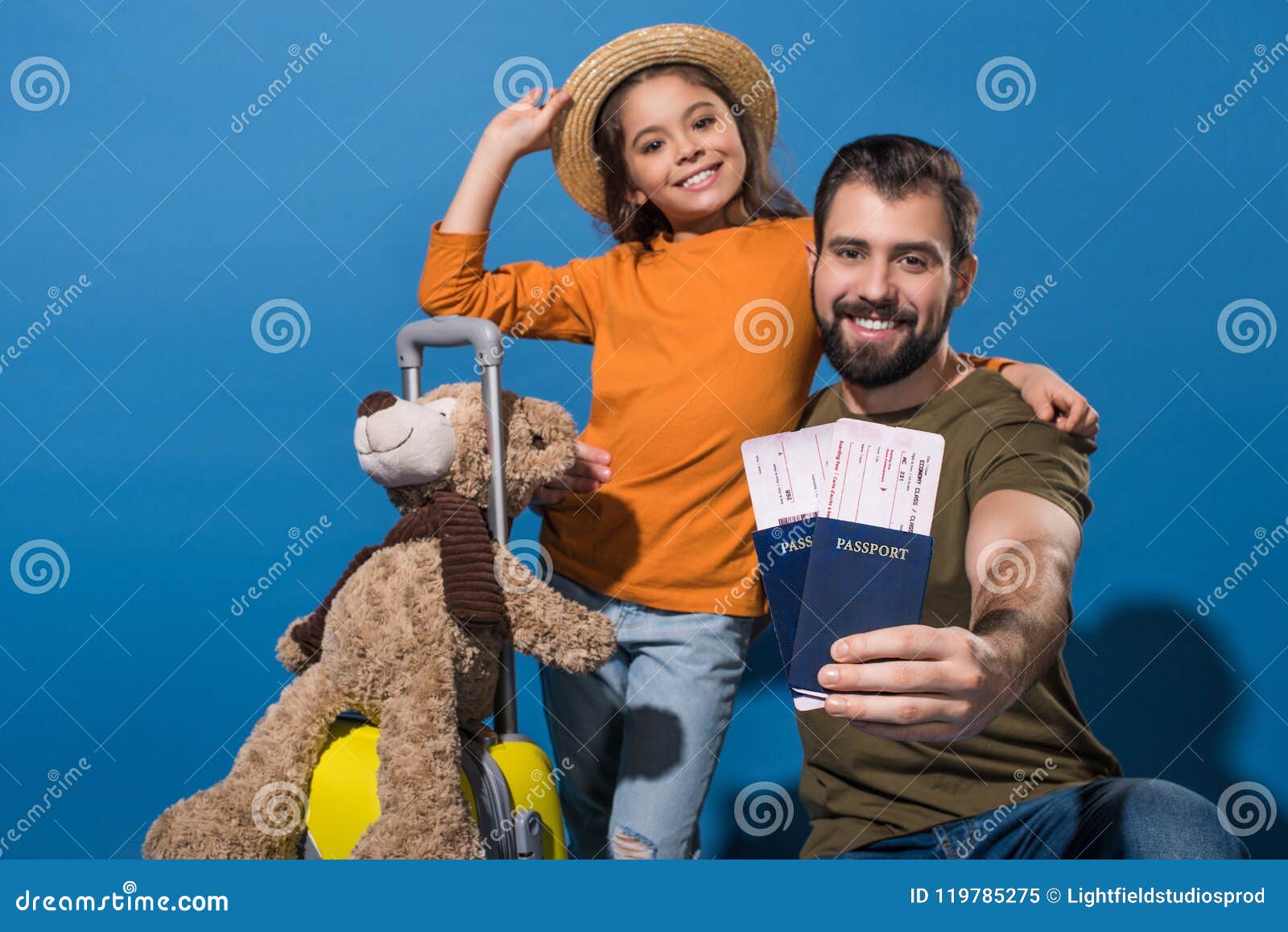 father and daughter with passports and tickets going on vacation