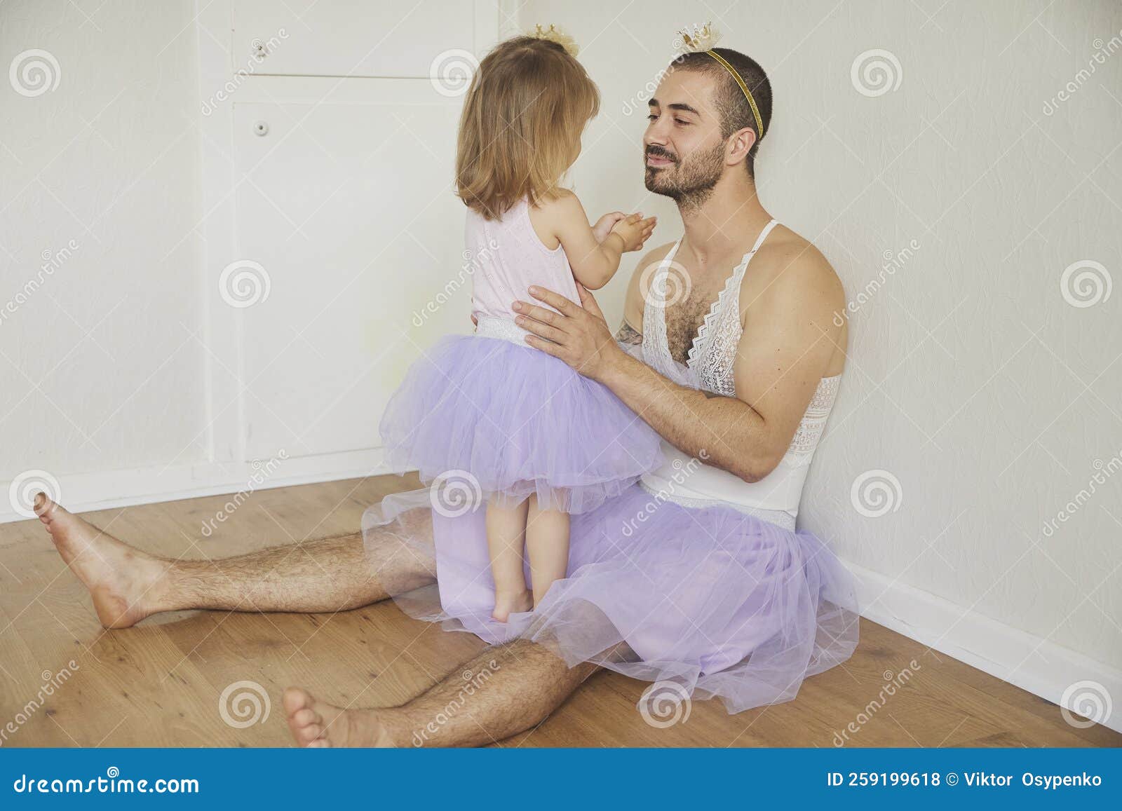 Father and Daughter Play Dressed Up As Princesses Stock Photo Image