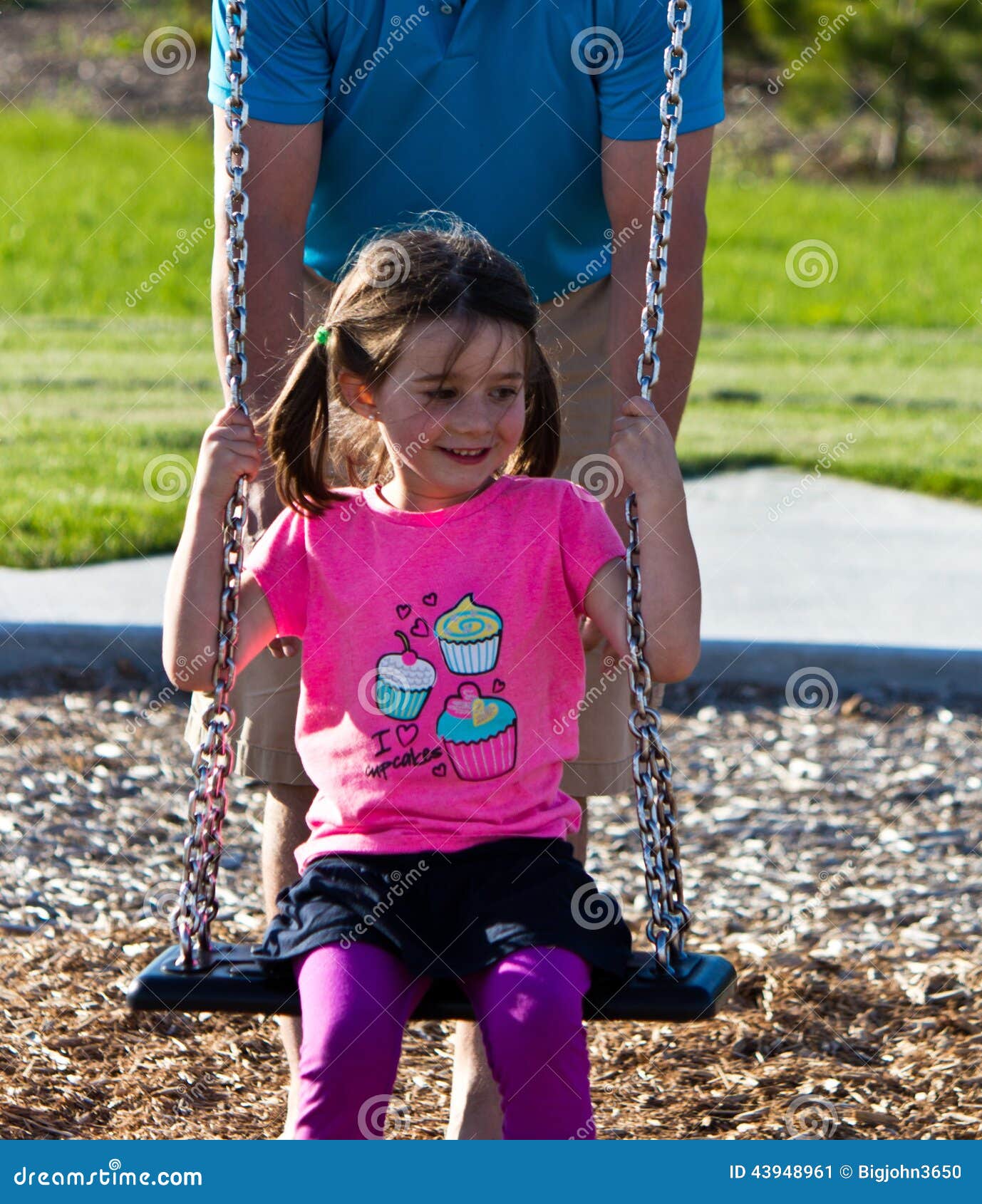 Father and Daughter Playing on the Swing at the Playground Stock Image ...