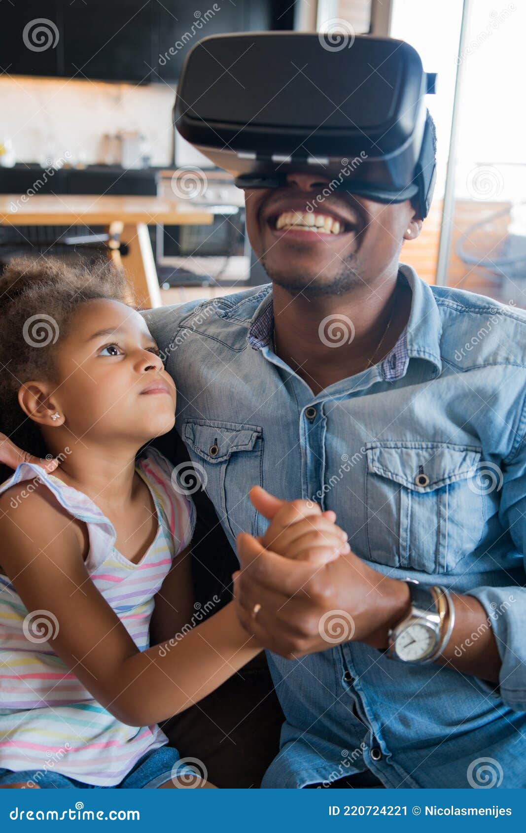 father and daughter playing video games.