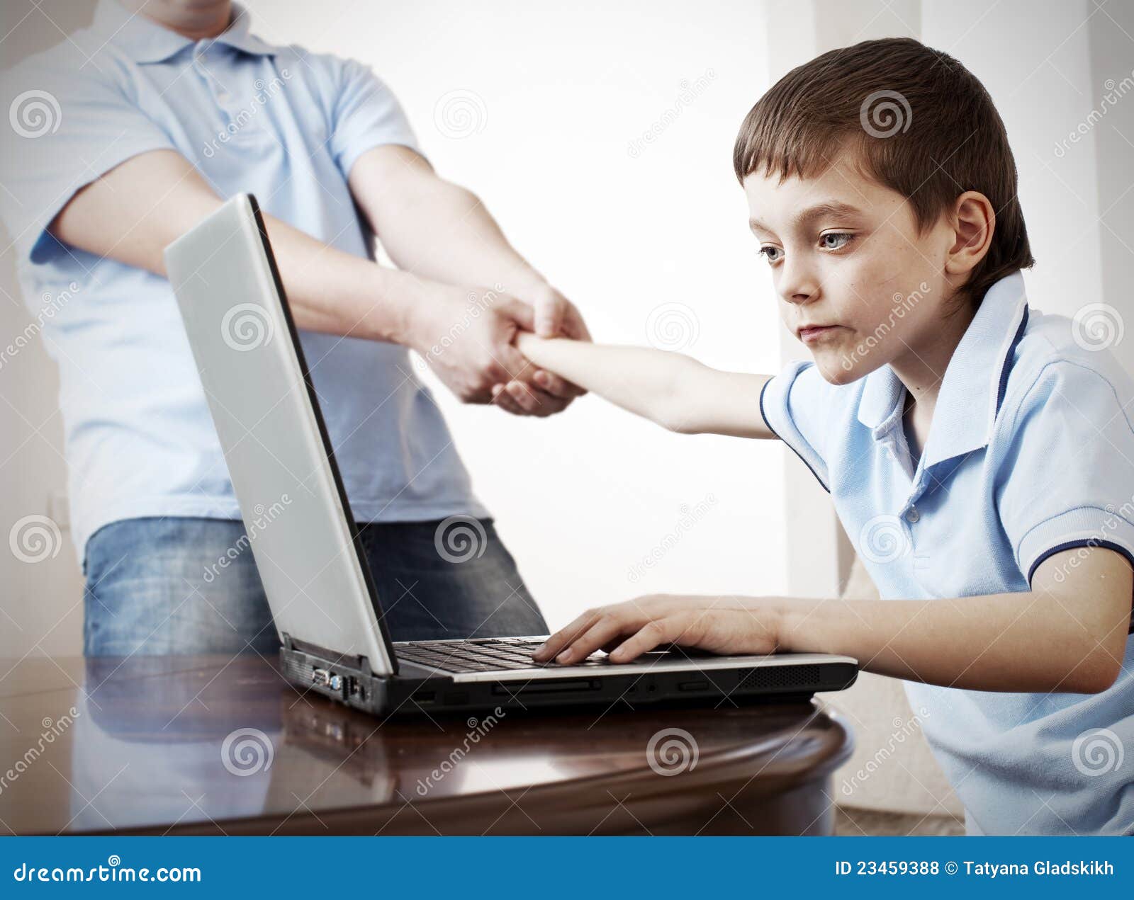Father Dragging Son From The Computer Stock Photo - Image ...