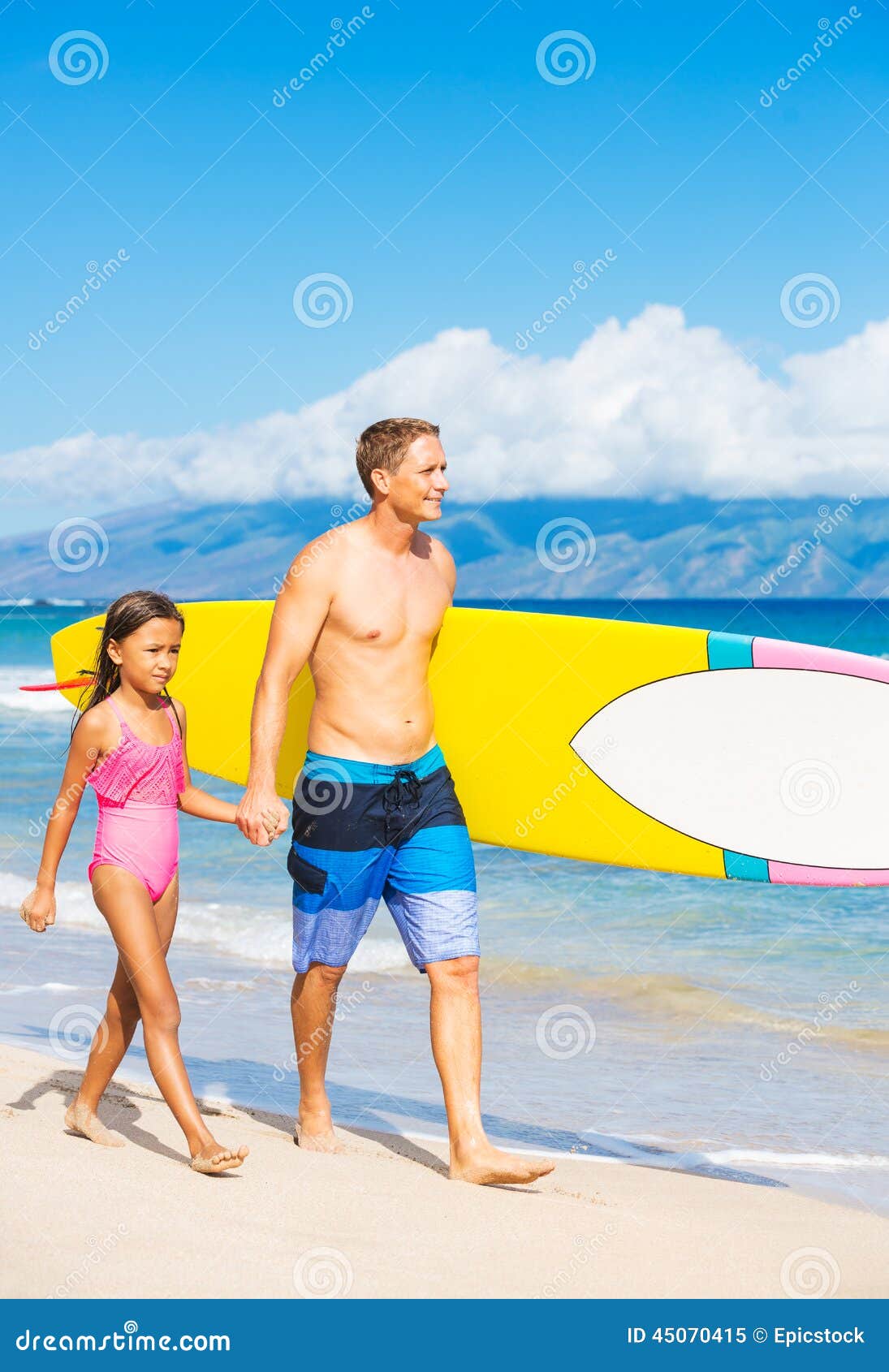 Father and Duagher on the Beach Going Surfing. Father and Daughter on the Beach going Surfing Together in Hawaii