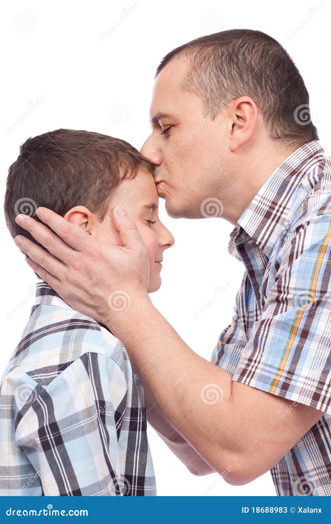 father-kissing-his-son-forehead-18688983.jpg