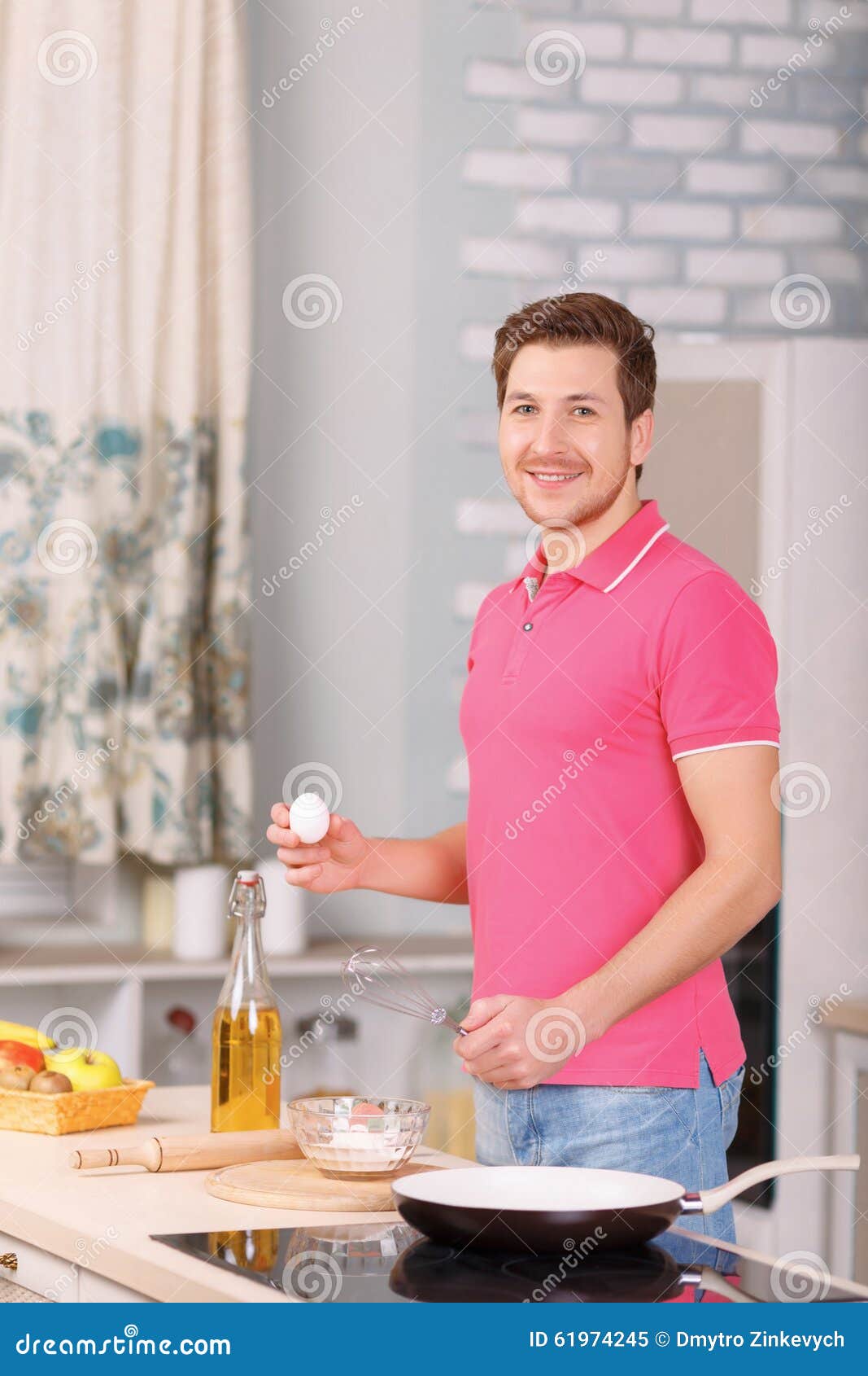 father makes scrambled eggs for breakfast