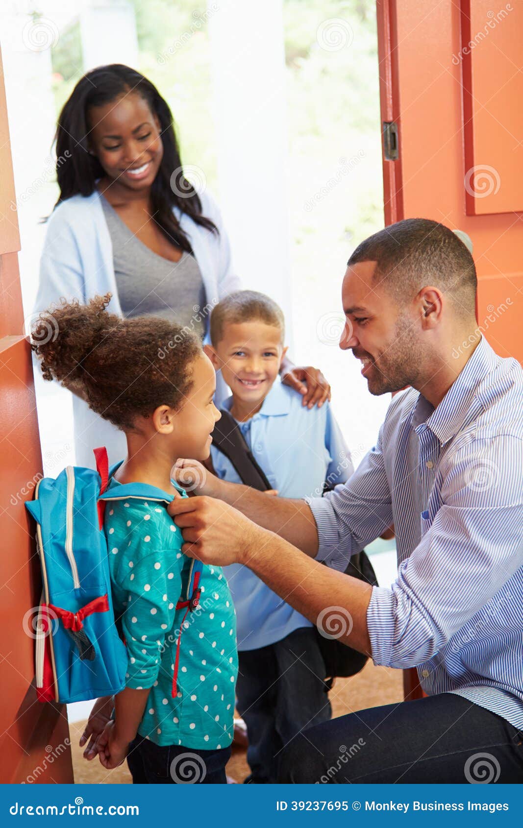 father saying goodbye to children as they leave for school