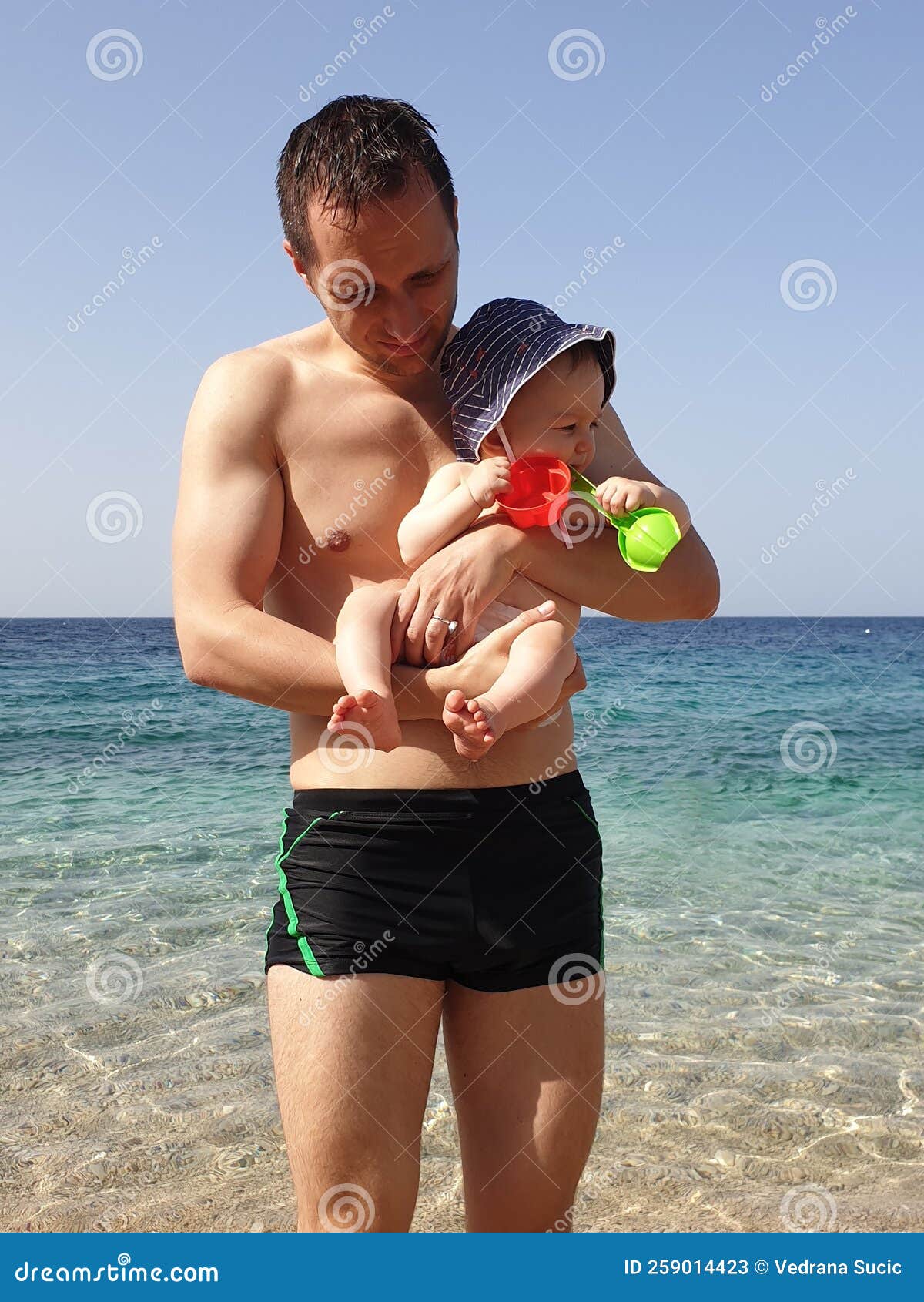 Father and Son on the Pebble Beach Stock Image Image of adorable
