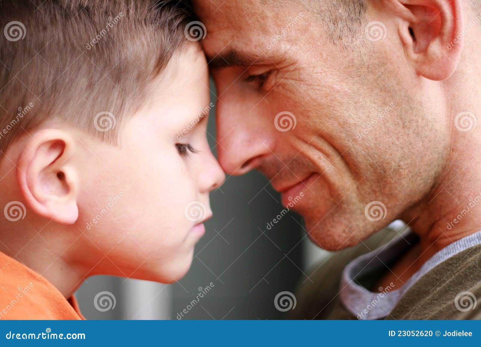 father and son portrait smiling