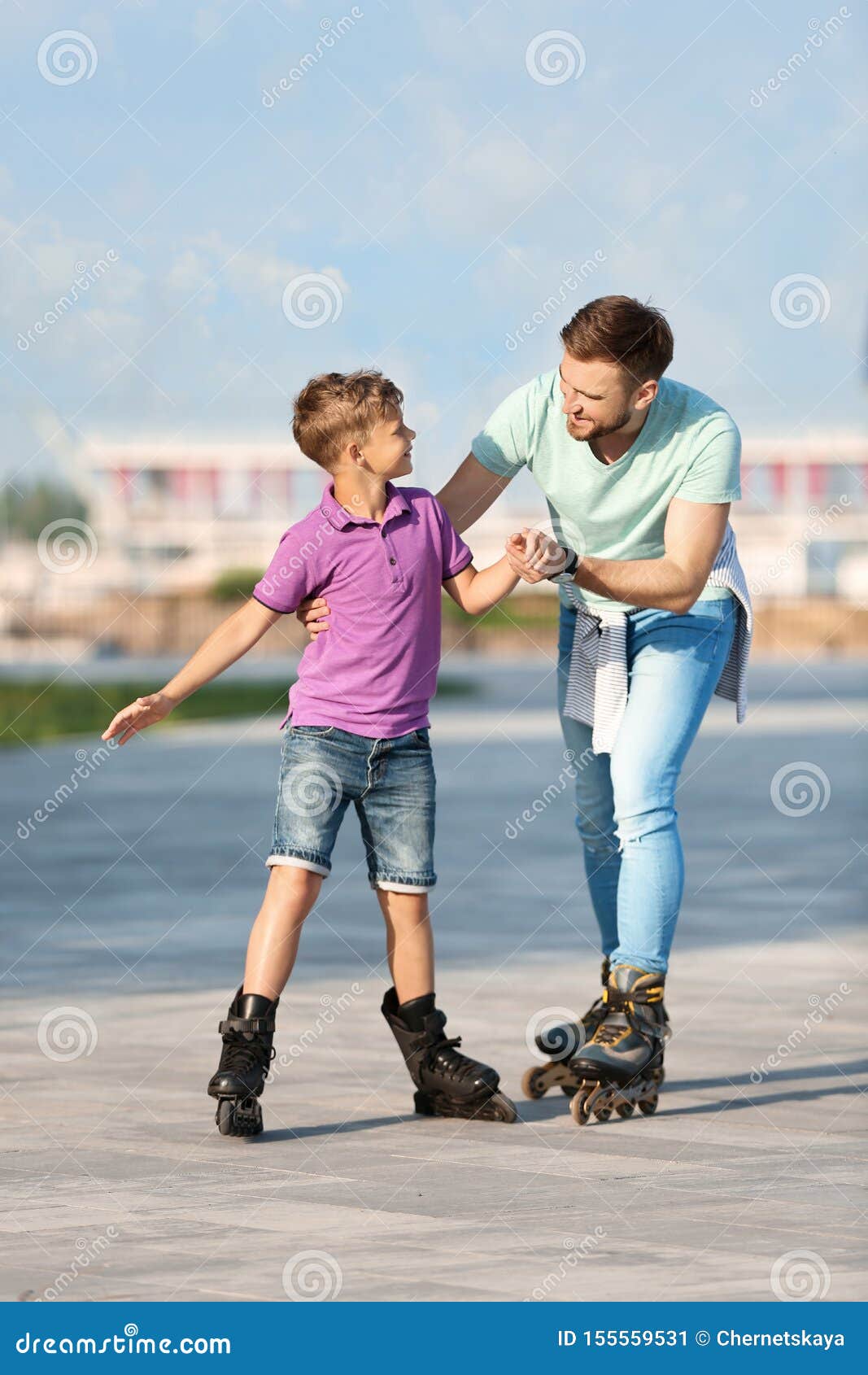 Father and Son Roller Skating on Street Stock Image Image of outdoors