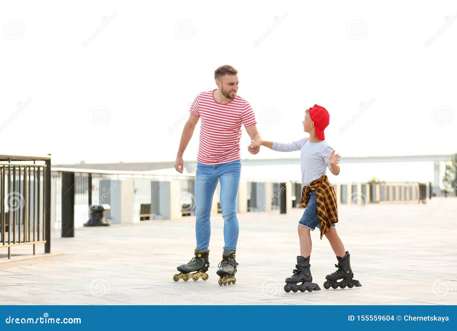 Father and Son Roller Skating on Street Stock Photo Image of love