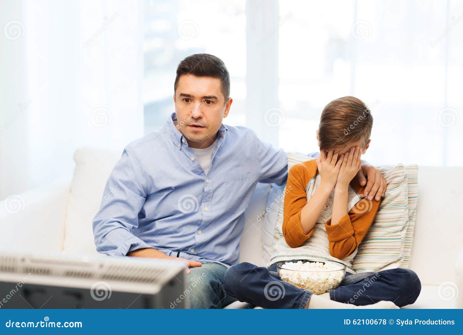 Image result for dad and son watching horror movie