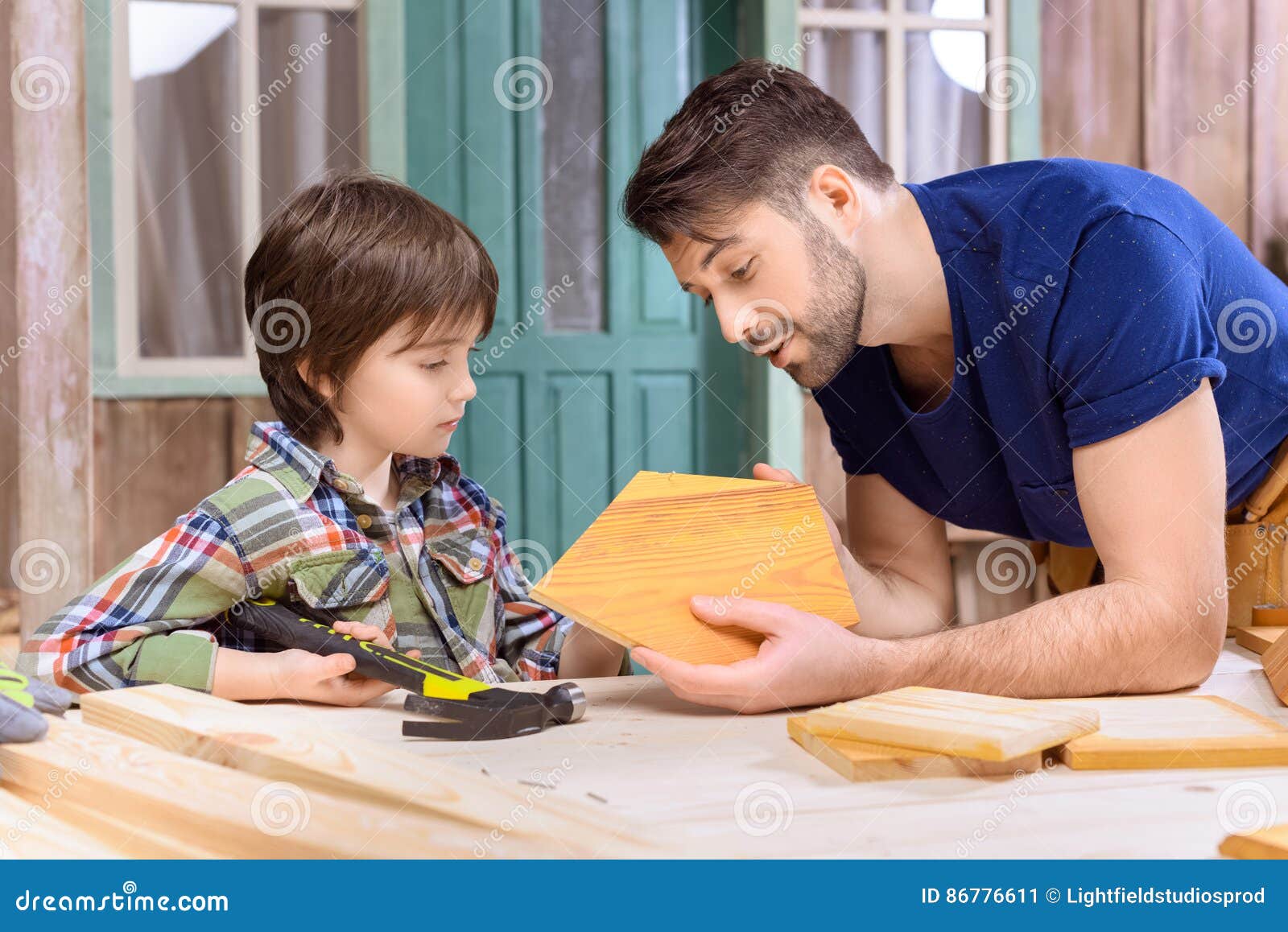 Father and Son Woodworking Together in Stock Image Image of