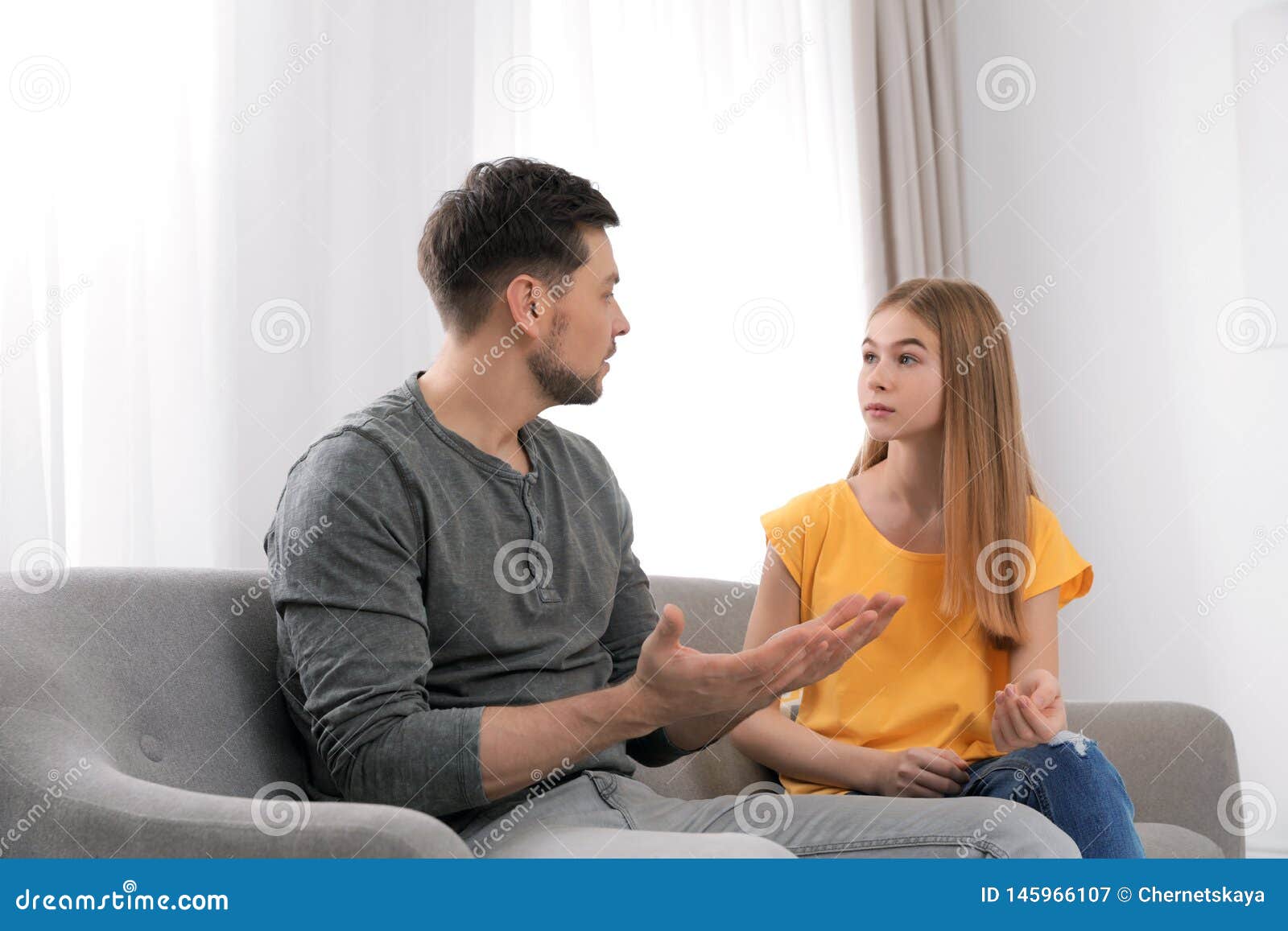 Father Talking With His Teenager Daughter Stock Image