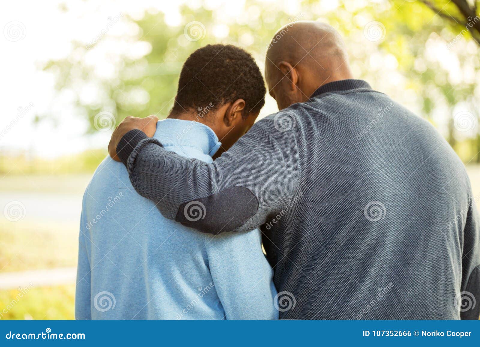 father talking and spending time with his son.