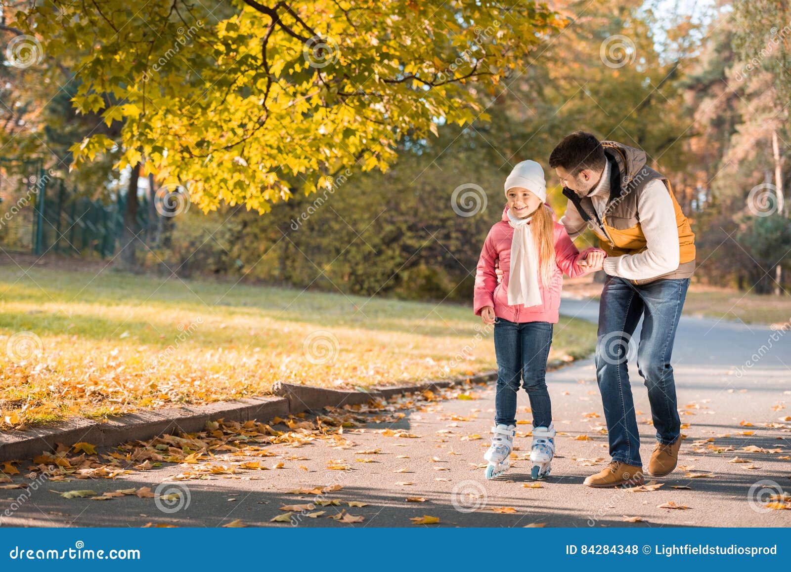 Father Teaching Daughter To Roller Skating Stock Photo - Image of park ...