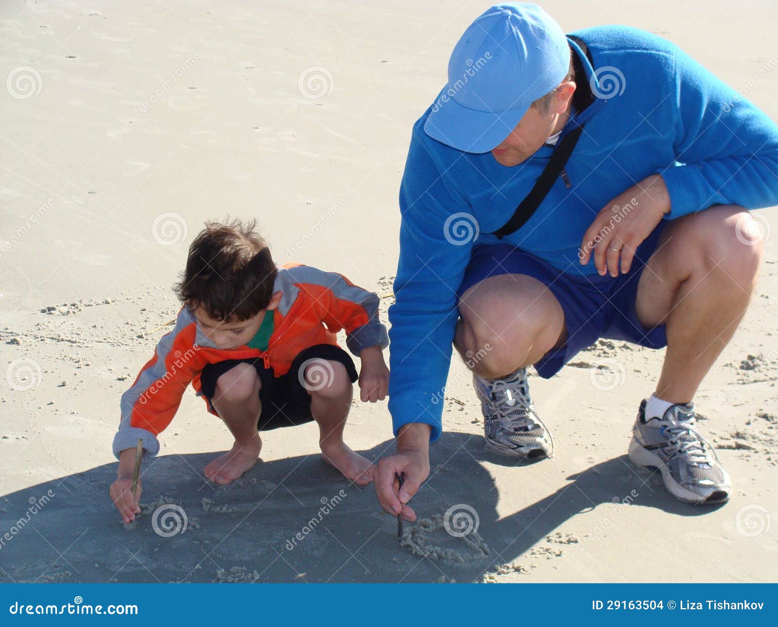 father teaching his son to write