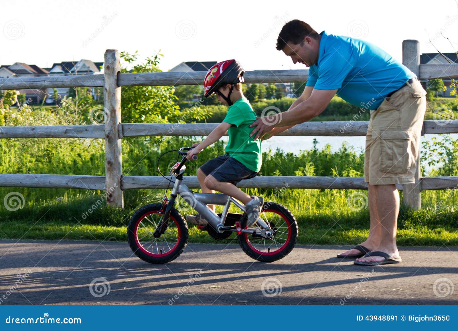 Father Teaching Son How To Ride a Bike Stock Image Image of bicycle