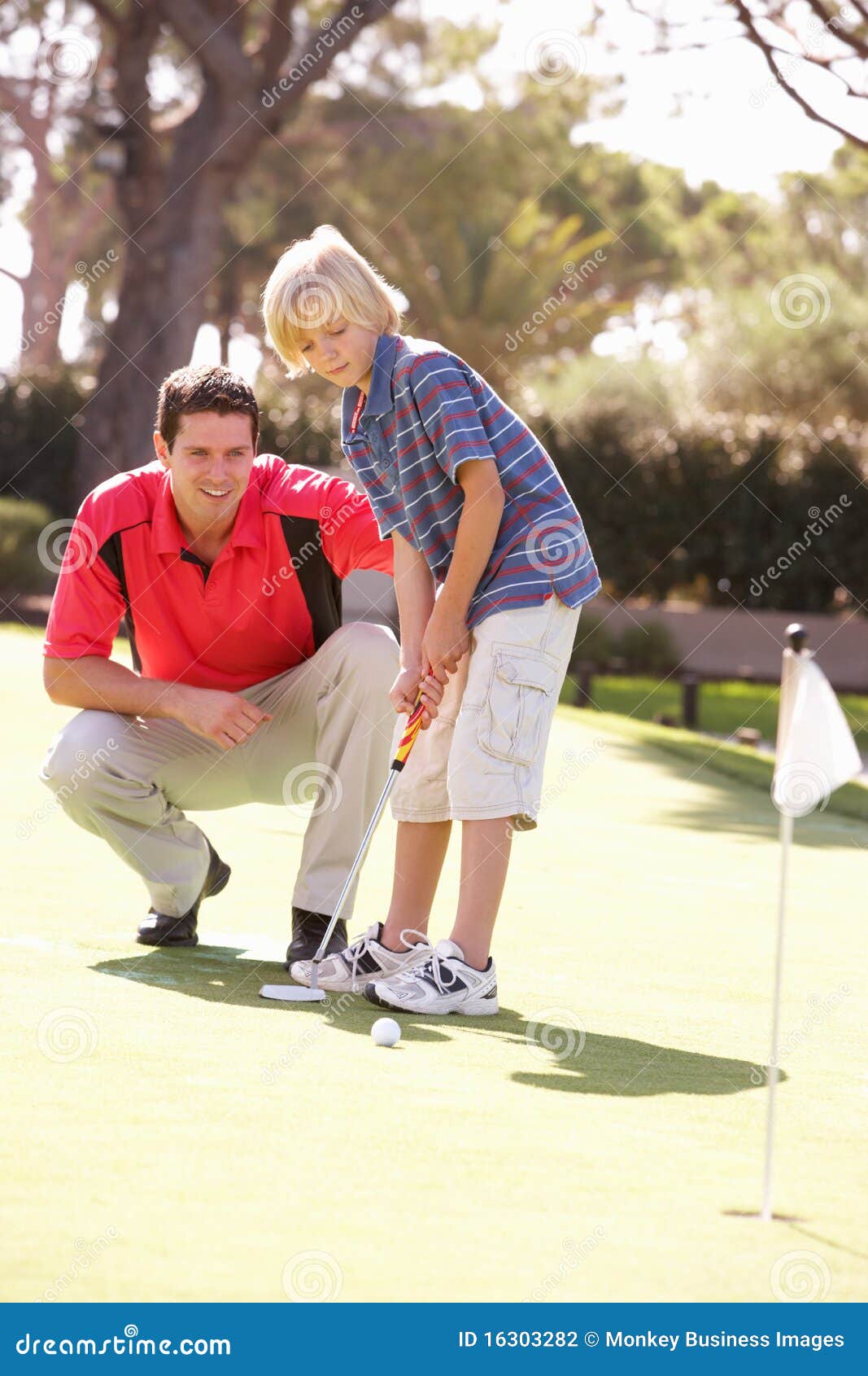 Father Teaching Son To Play Golf Stock Photo - Image of ...