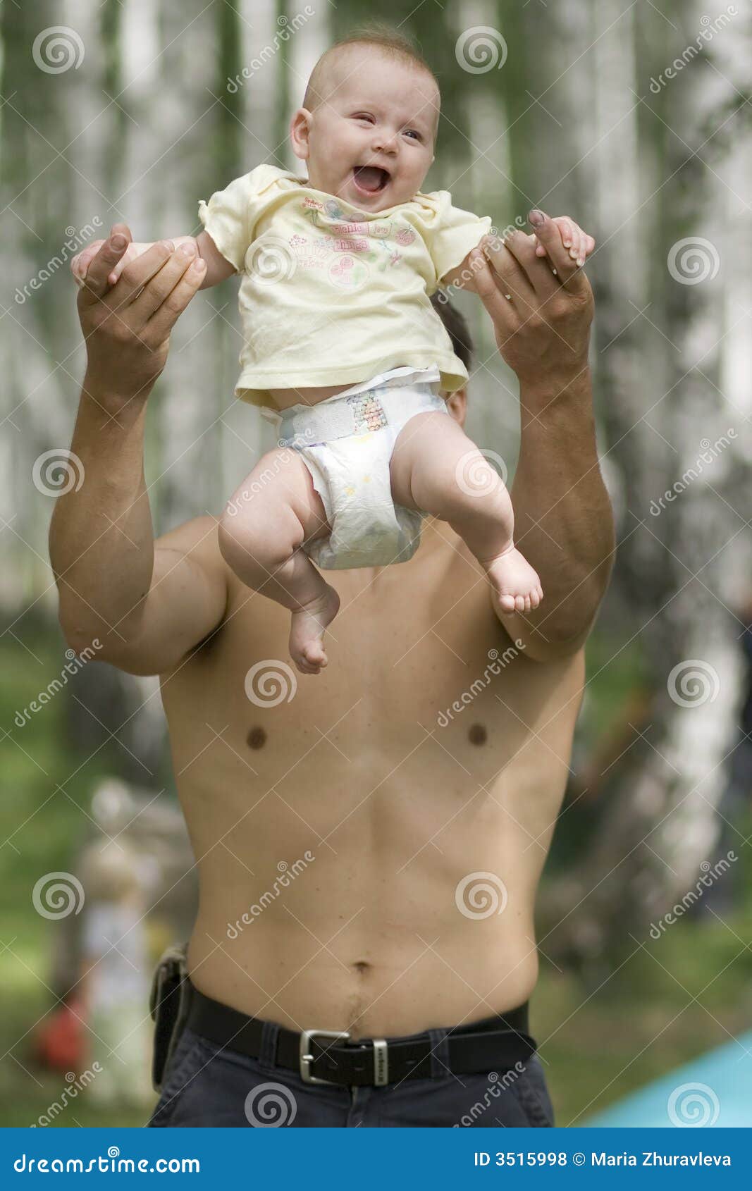 father toss up his baby