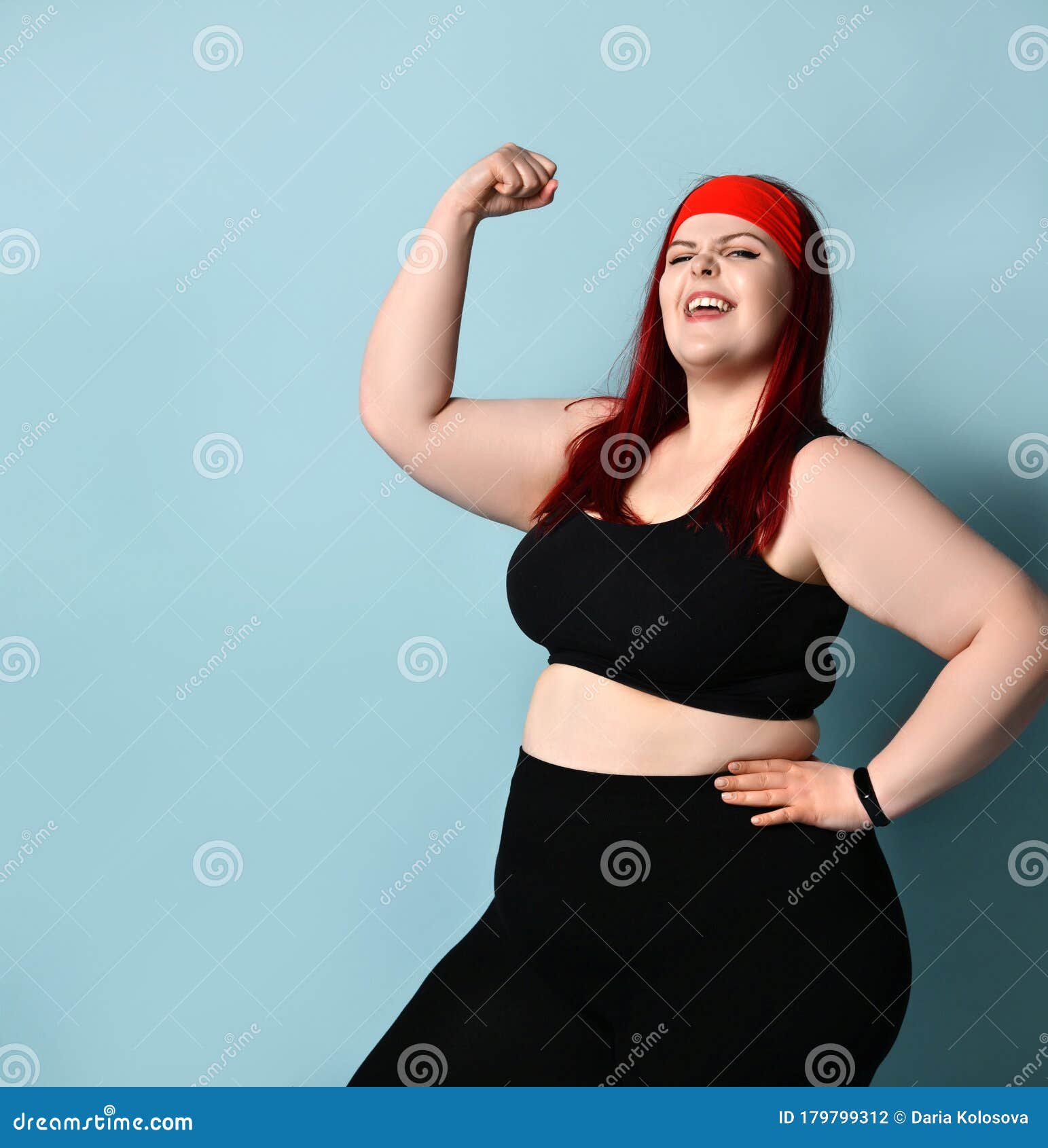 Fatty Ginger Female in Red Headband, Black Top and Leggings, Fitness ...