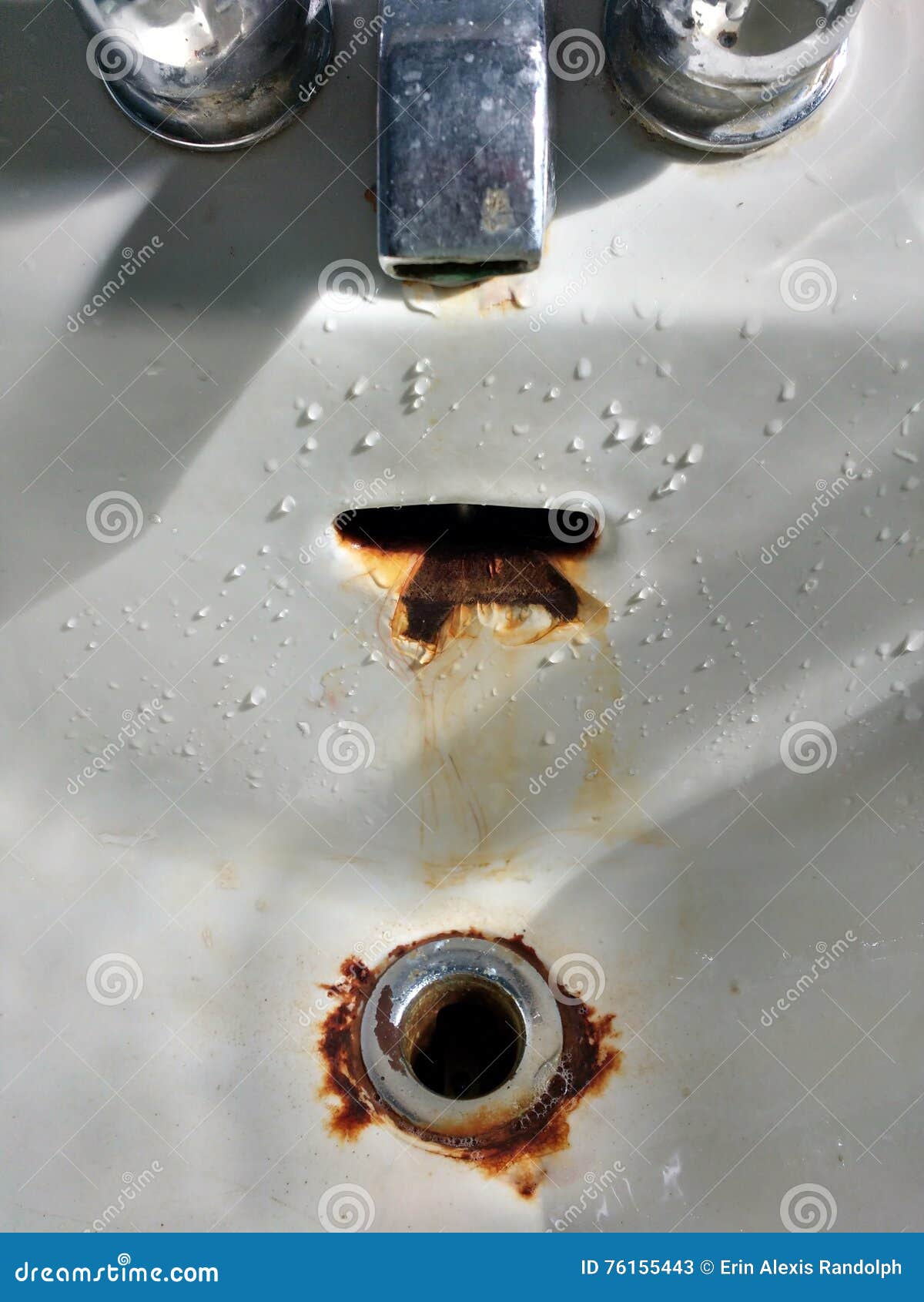 Faucet Dripping In A Porcelain Sink With Rusty Drain Stock