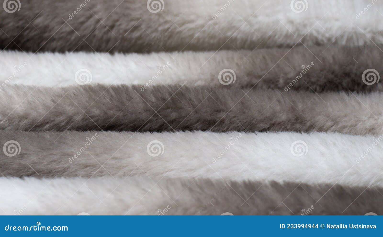 faux fur texture in the form of waves of gray color. the concept of abandoning natural fur