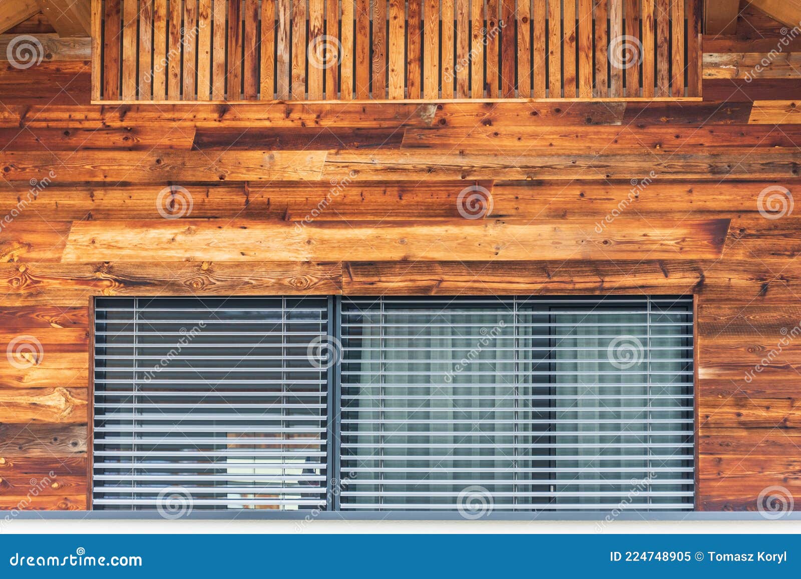 the faÃÂ§ade of the building with a large window with an external roller shutter