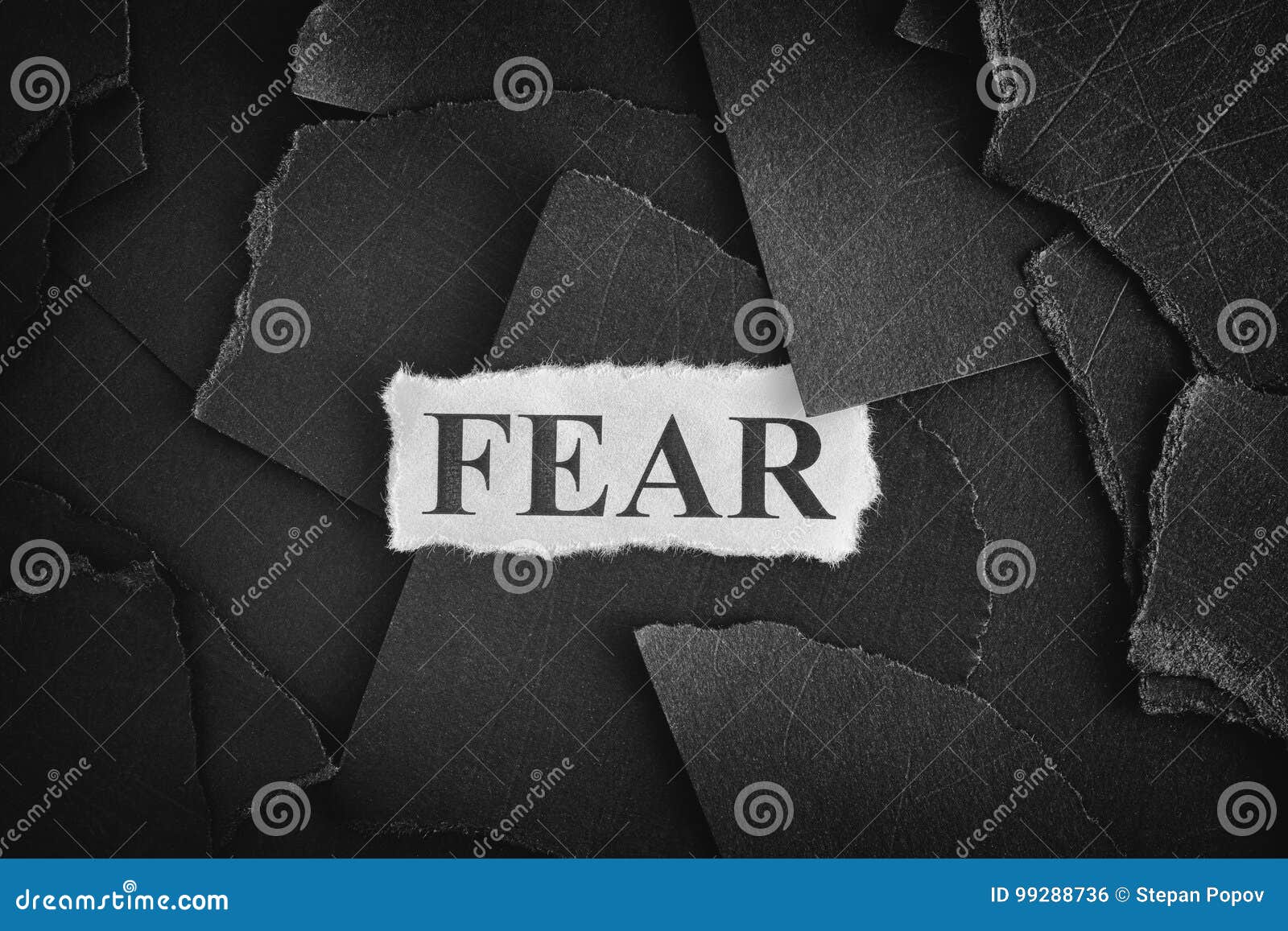 Fear. Torn Pieces of Black Paper and Word Fear Stock Photo Image of