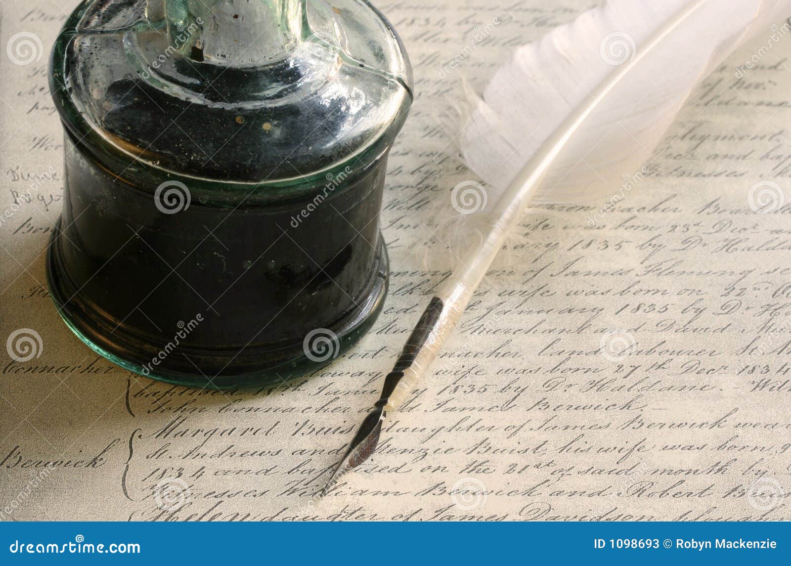 feather quill pen and inkwell