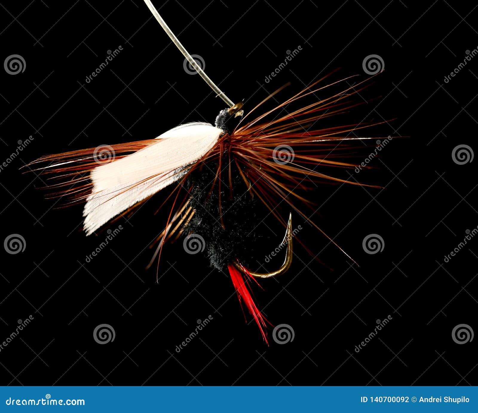 Feathers on the Hook for Fishing on a Black Background Stock Photo