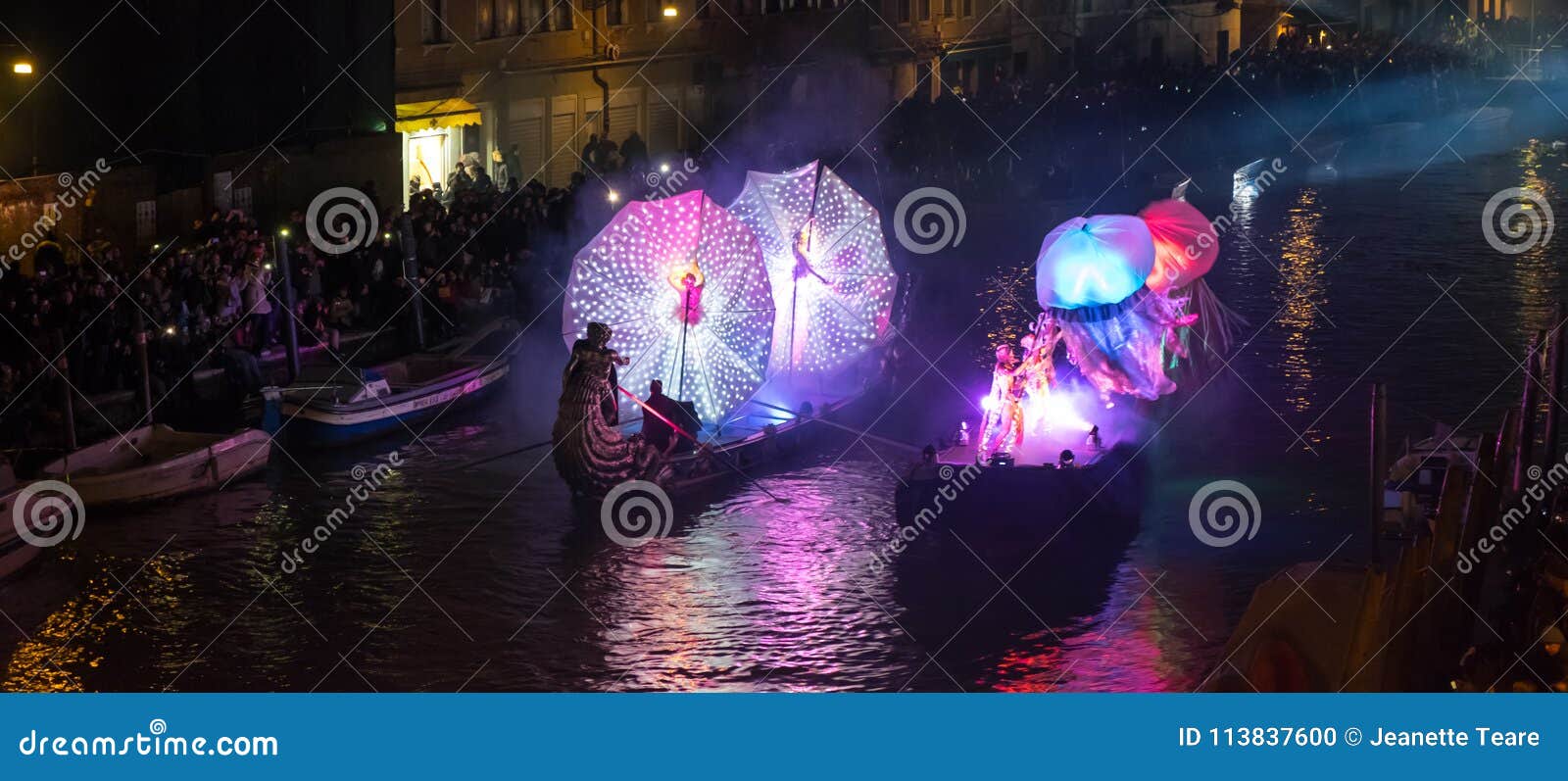 Feb 2017, Venice, Italy. Illuminated carnival floats at the opening of the carnival. Spectators line the banks of the canaregio canal in Venice, to see the spectacular illuminated floats.