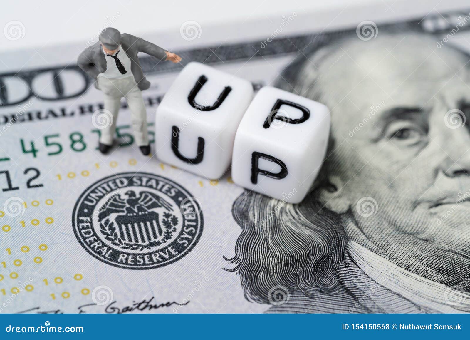 fed, federal reserve with interest rate cut concept, businessman standing with small cube block with alphabet building the word