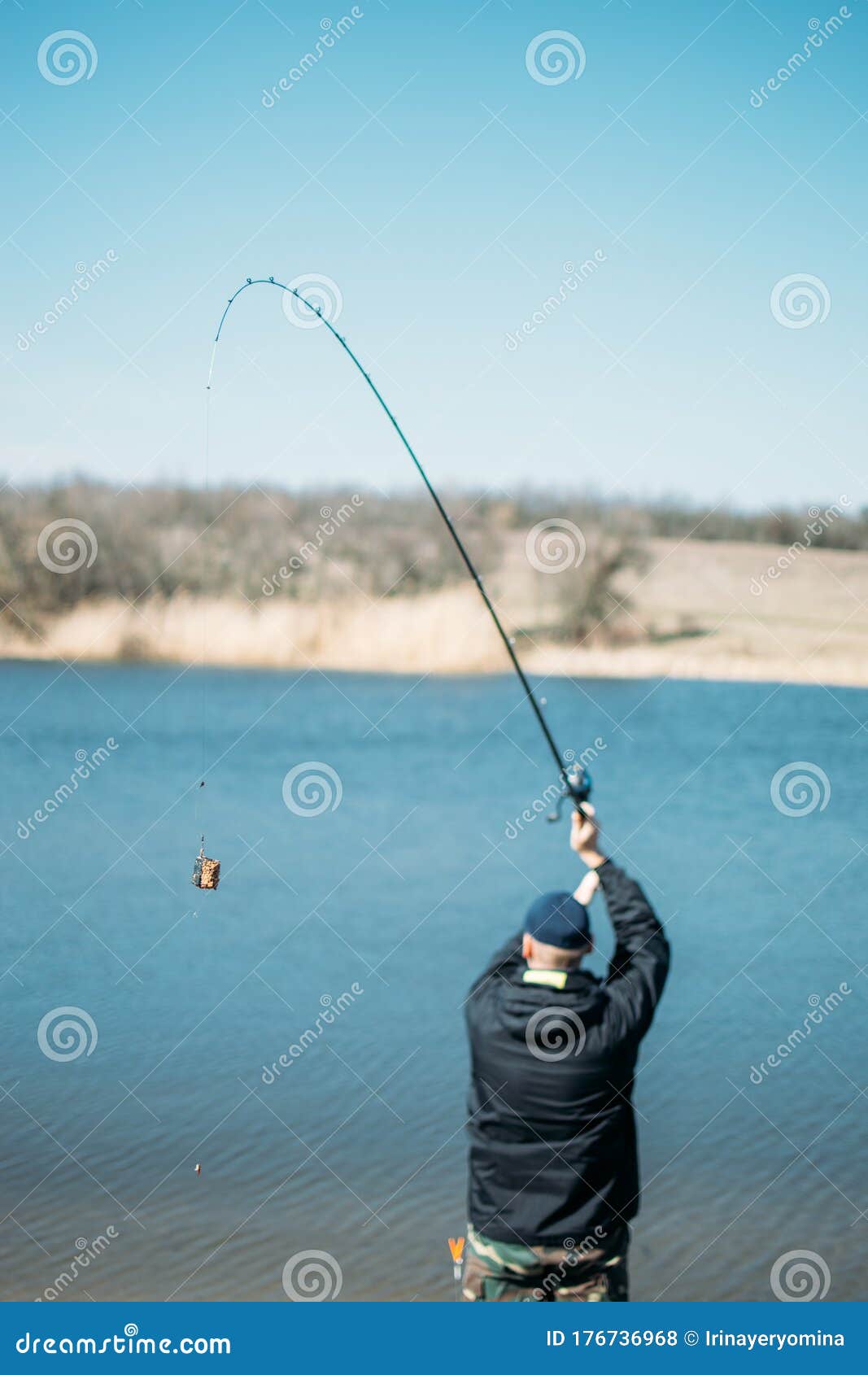 https://thumbs.dreamstime.com/z/feeder-fishing-carp-fishing-steel-basket-bait-feeder-rod-close-up-male-fisherman-fishing-sun-day-lake-feeder-fishing-176736968.jpg