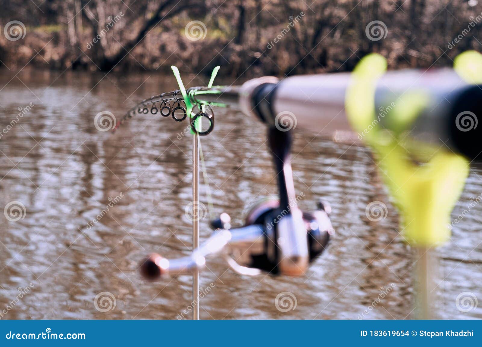 https://thumbs.dreamstime.com/z/feeder-fishing-rod-stand-against-background-river-closeup-183619654.jpg