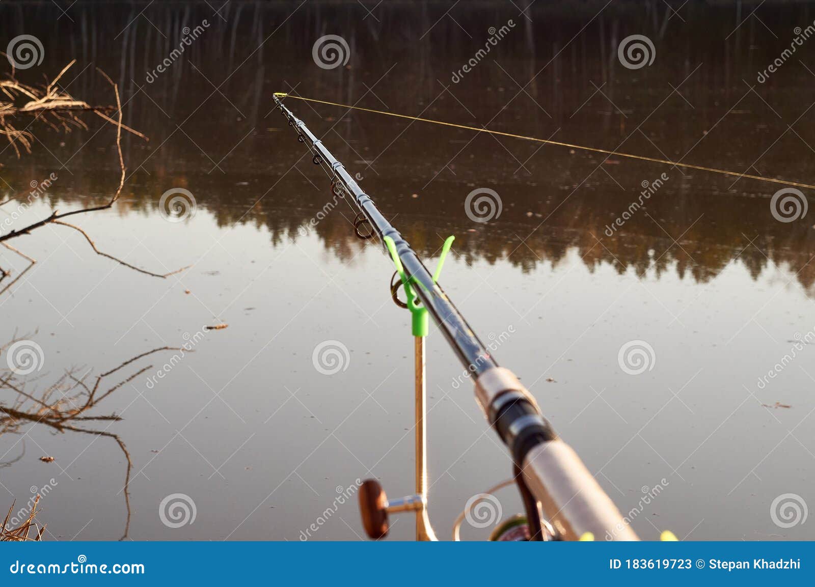Feeder Fishing Rod on the Stand Against the Background of the River.  Closeup Stock Image - Image of water, reel: 183619723