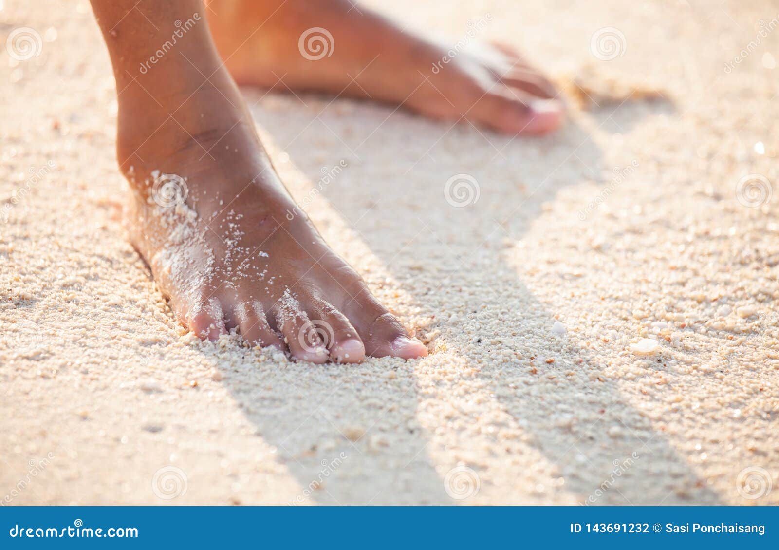 Feet of Child Girl Standing on the Beach with Shadow in Sunset Time ...