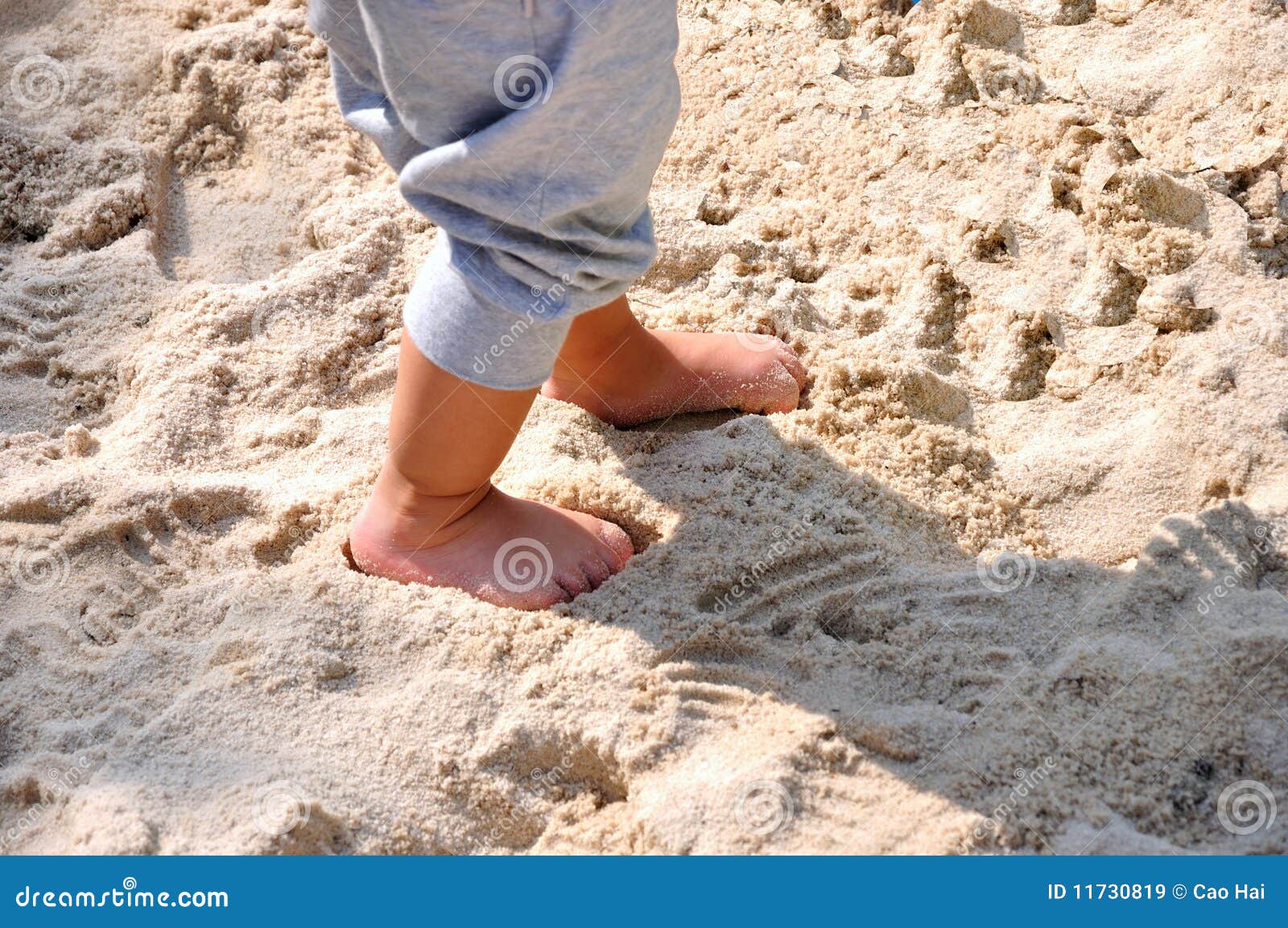 Feet of a child on sand stock image. Image of child, enjoy 11730819