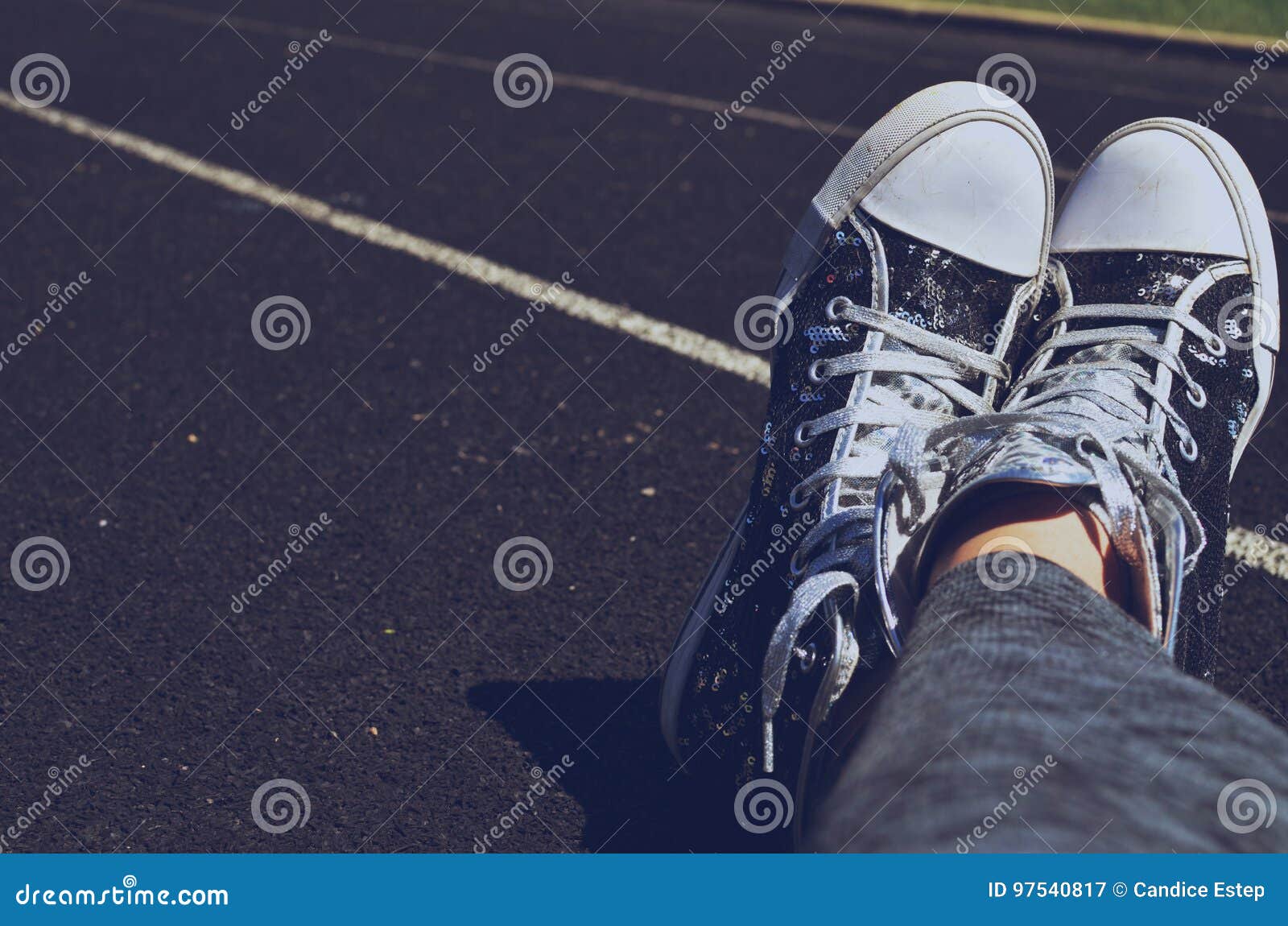 Feet Crossed in Shoes on Track Stock Image - Image of black, shoes ...