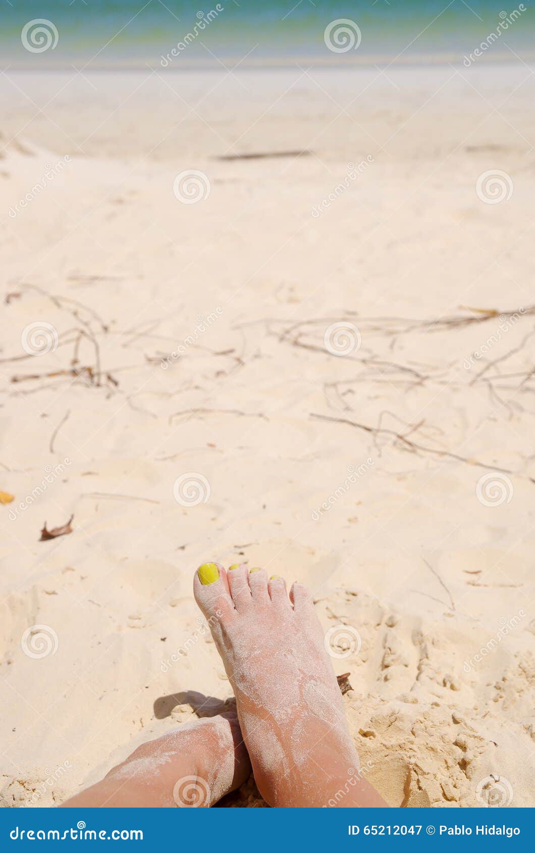 Feet Crossing Over Each Other Covered in Sand on Stock Image - Image of ...