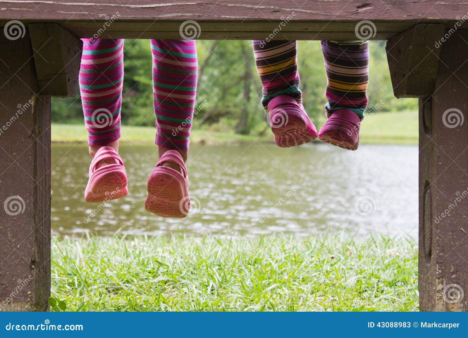 Feet hanging from a bench stock image. Image of ohio 43088983