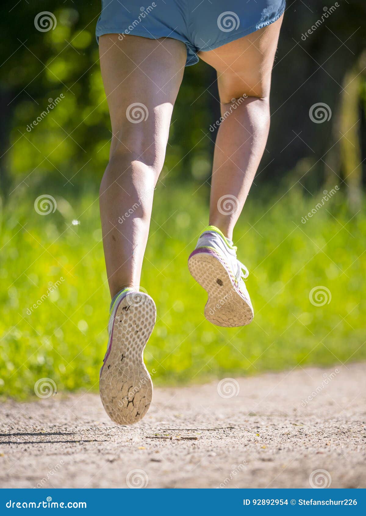 Feet of a jogger stock photo. Image of training, road 92892954