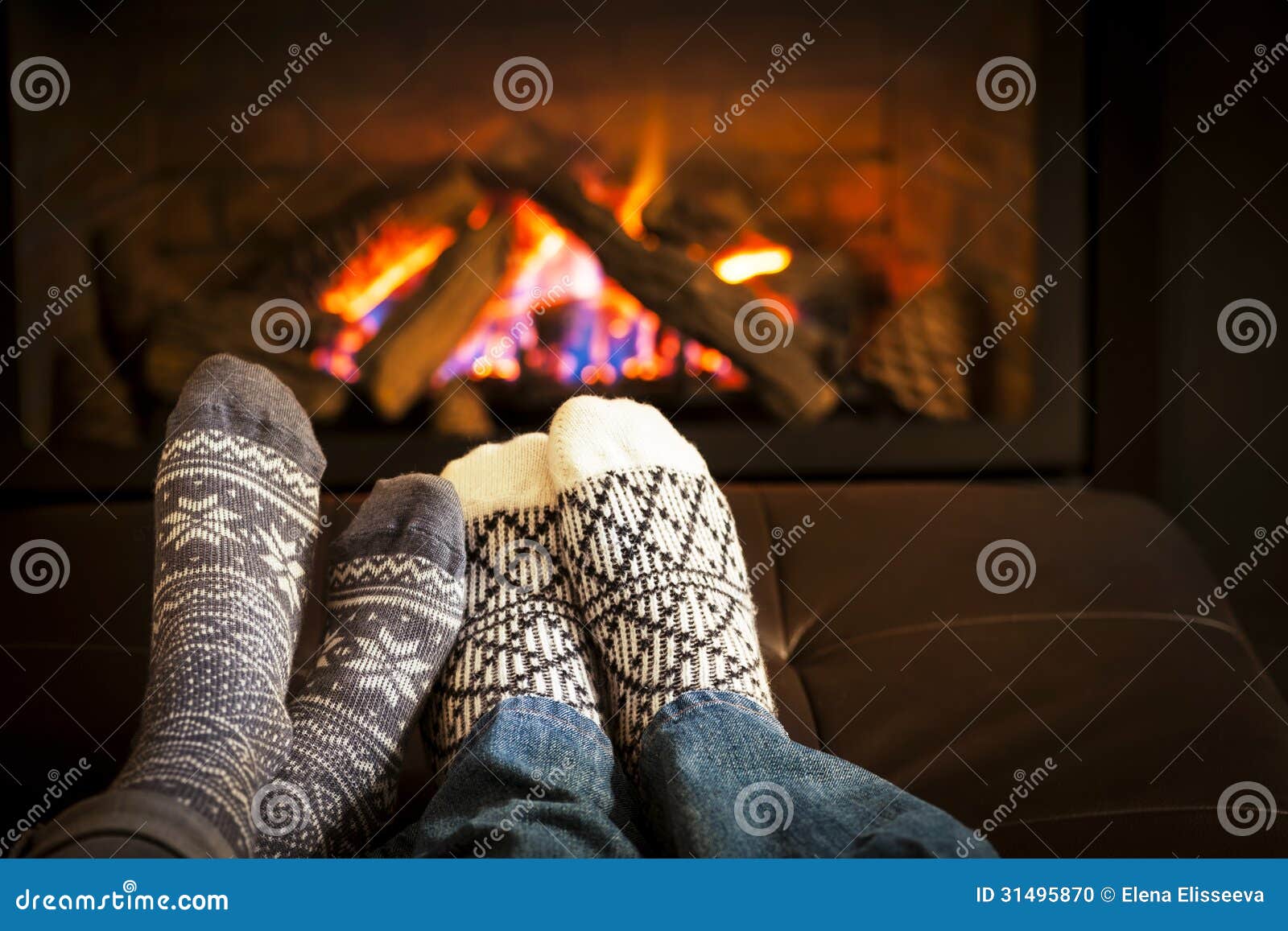 Feet warming by fireplace stock photo. Image of indoors 31495870