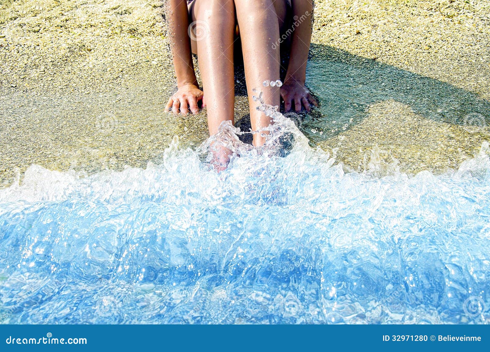 Feet washed in ocean wave stock photo. Image of barefoot 32971280