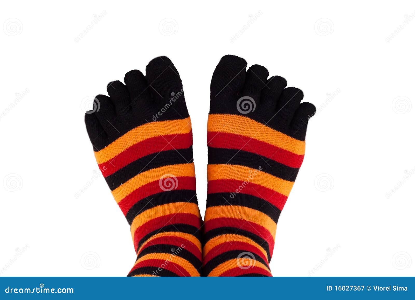 Feet wearing colored socks stock image. Image of stripes 16027367